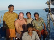 Graeme with local fishermen on Quiet Achiever